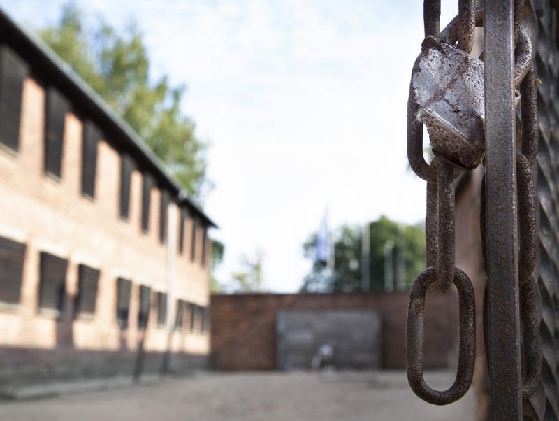 Gate with chains and courtyard at Auschwitz-Birkenau